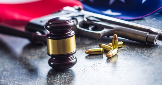 gun, bullets, gavel, and flag